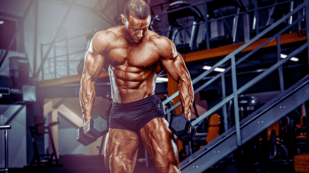 A Bodybuilder With Dumbbells Posing 