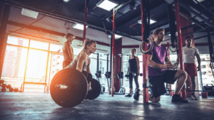 A CrossFit Gym With Men And Women Working Out