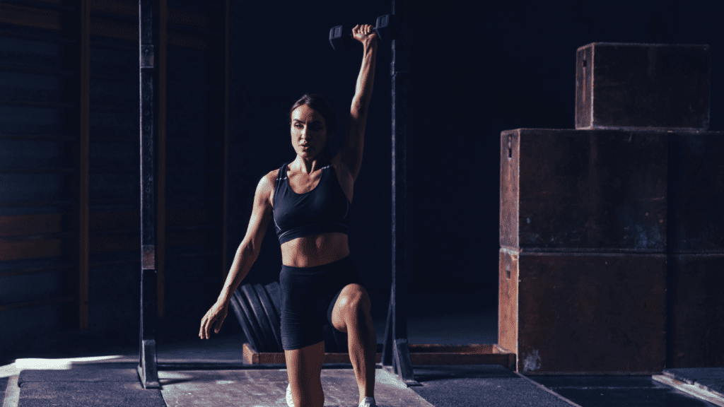 A Woman Doing CrossFit Training With A Dumbbell