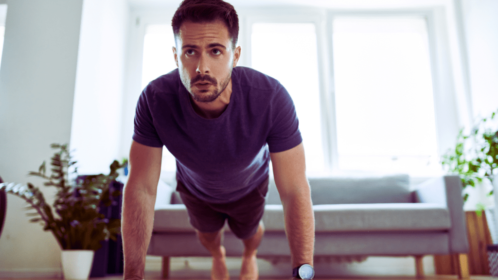 A Man Doing Push Ups At Home 