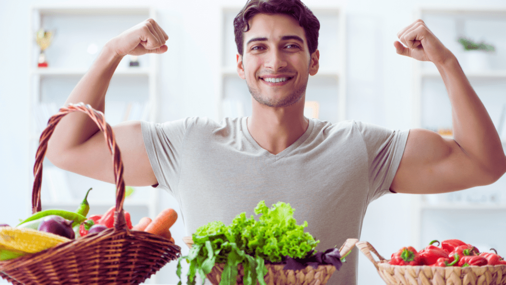 A Man Showing Muscles Next To Healthy Food