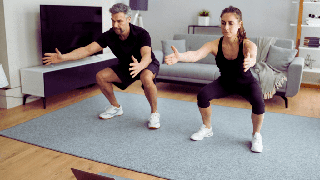 A Man And A Woman Doing Simple Workout At Home Routine 