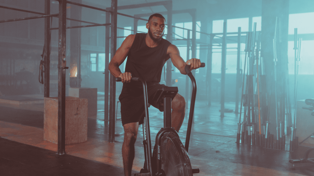 A Man Training With The Elliptical Trainer