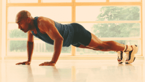 A Man Doing Push-ups At Home