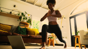 A woman doing home workout using online timps