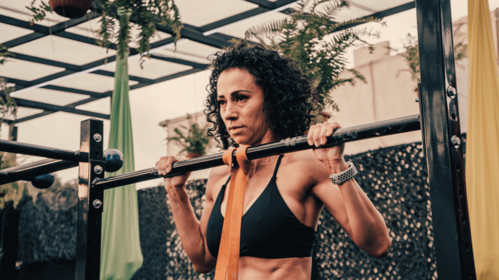 Bodyweight Exercises for Muscle Gain: A Woman Doing Pull Ups 