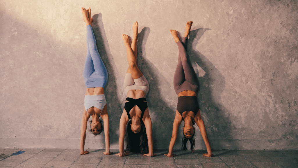 3 Women Doing Hand Stands 