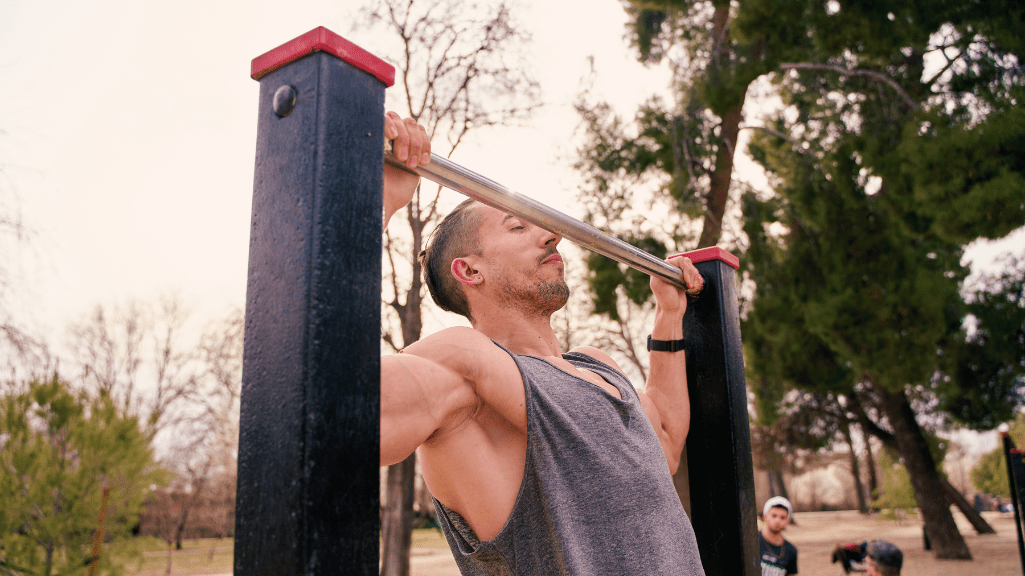 A Man Doing Wide Spread Pull Ups 