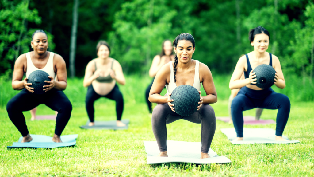 A Group Outdoor Workout With A Medicine Ball 