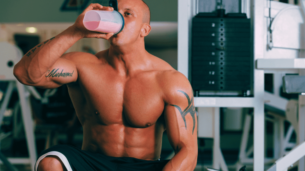 A Bodybuilder Drinking His Protein Supplement 