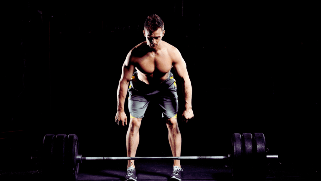 A Man Who Is About To Perform A Deadlift