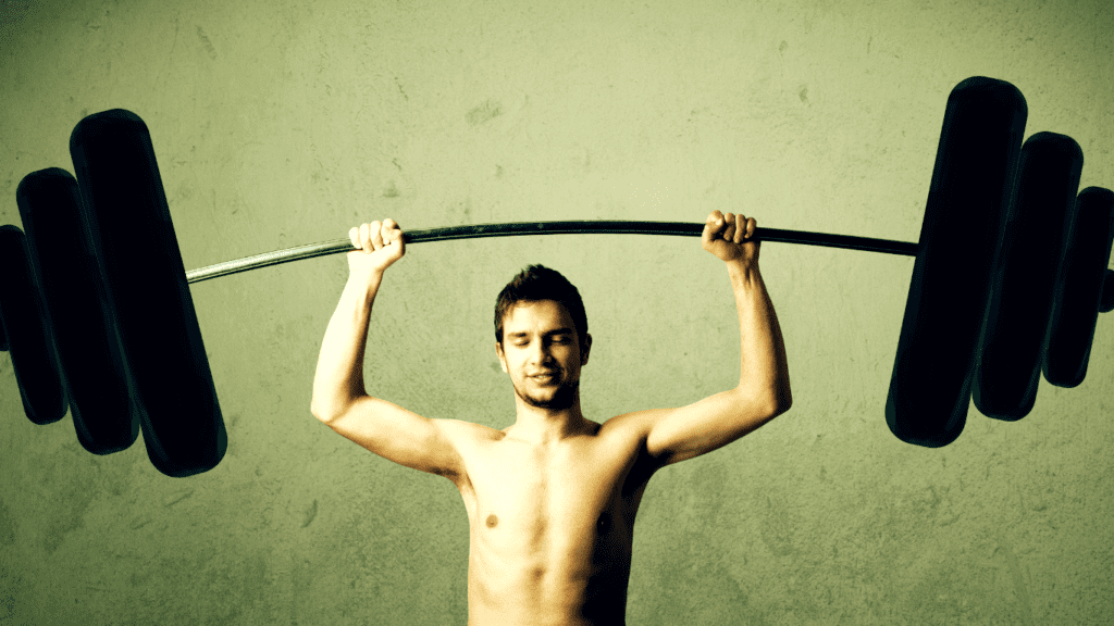 A Very Skinny Man Lifting Heavy Barbell Over His Head 