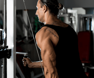 a man in gym working on his triceps 