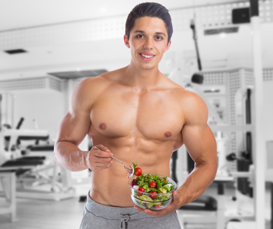 a bodybuilder holding a ball of salad 