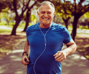 a senior man jogging in the park 