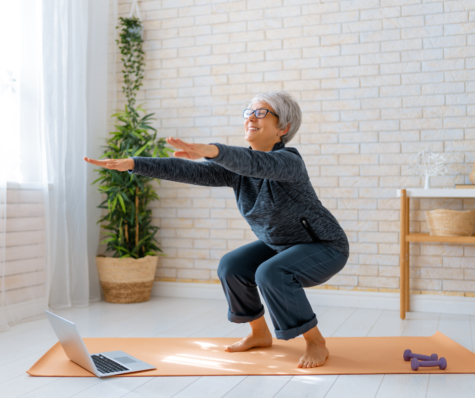 a senior woman is exercising at home on a yoga mat 