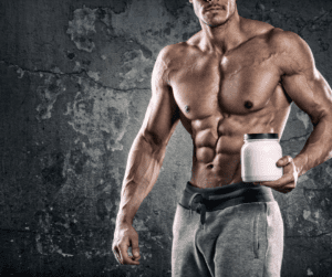 a half naked bodybuilder with creatine box in hand 