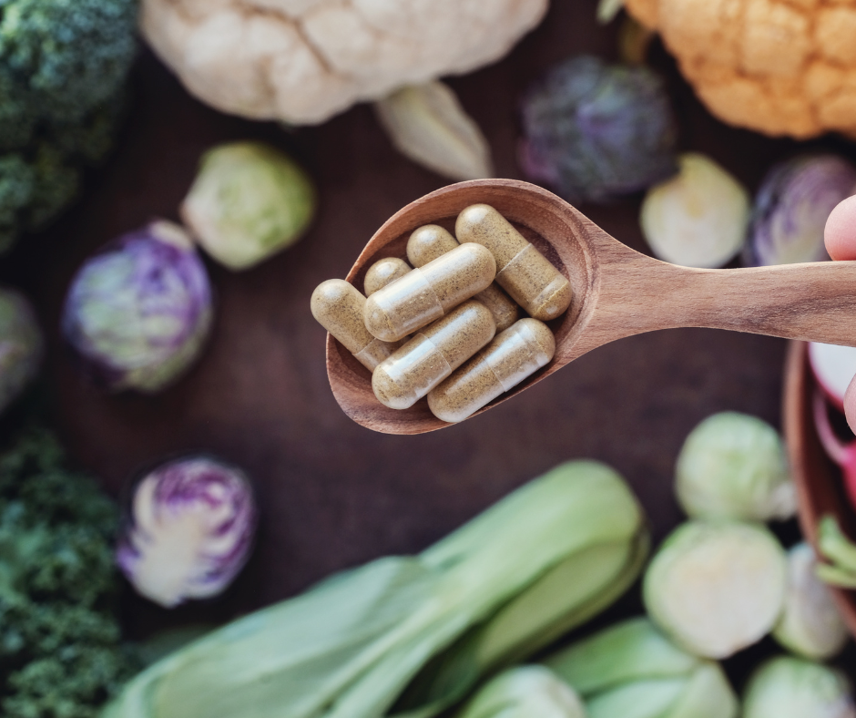 vegetables and a spoon with pills