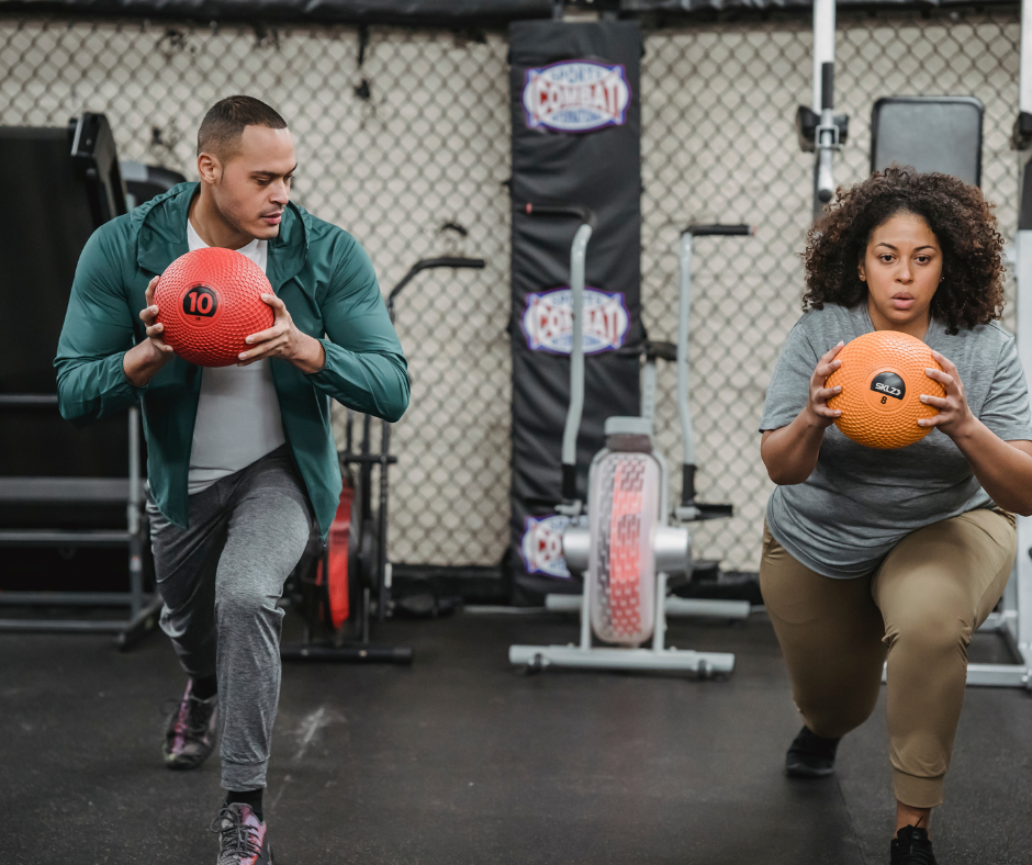 a man and a woman with a ball doing functional fitness training