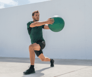 a man doing core exercises with a medicine  ball 