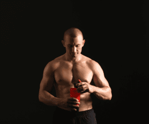 a bodybuilder taking a protein shake