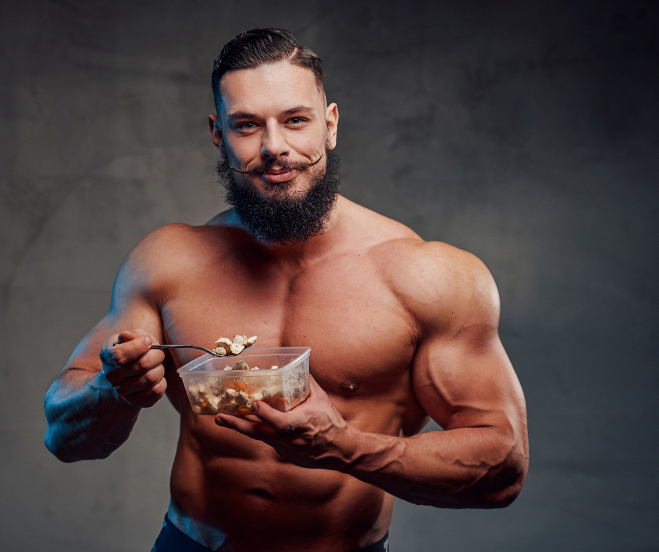 a bodybuilder eating his food 