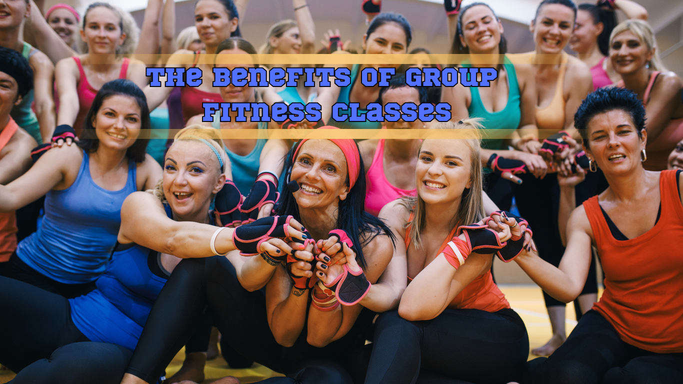 group photo of a fitness class and a sign:The Benefits of Group Fitness Classes