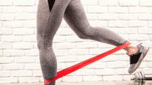 a resistance bands around the ankles for butt workout 