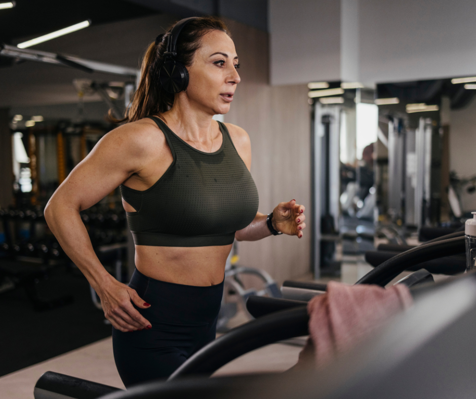 a woman doing cardio on a trade mill 