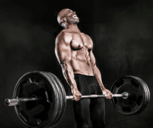 a bodybuilder doing dead lift with big weights and struggling 