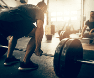 a white man about to perform a dead lift