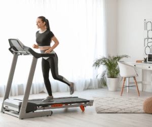 woman doing her cardio in her home treadmill