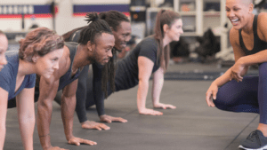 a fitness group doing push ups 