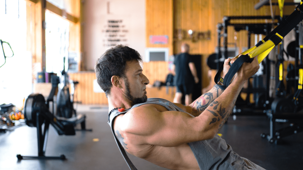 Man performing TRX ROW at the gym