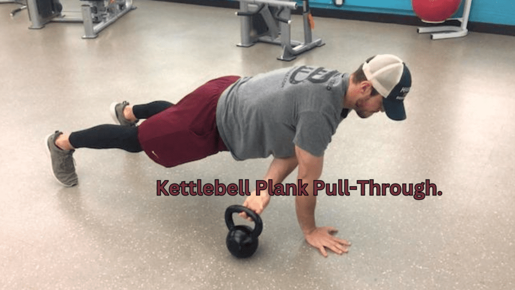 A man performing Kettlebell Plank Pull-Through Exercise 