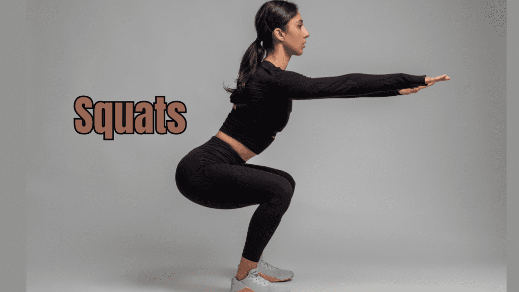 A woman in black doing squats 