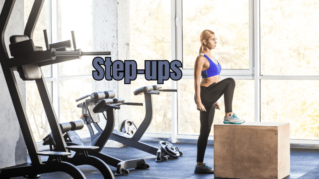 a woman doing step ups at the gym 