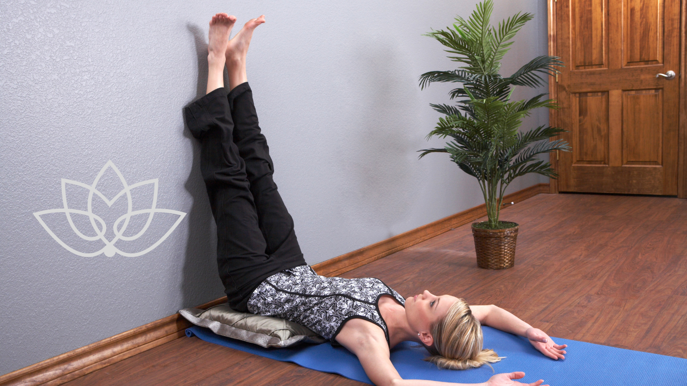 woman performing Legs-Up-The-Wall Pose