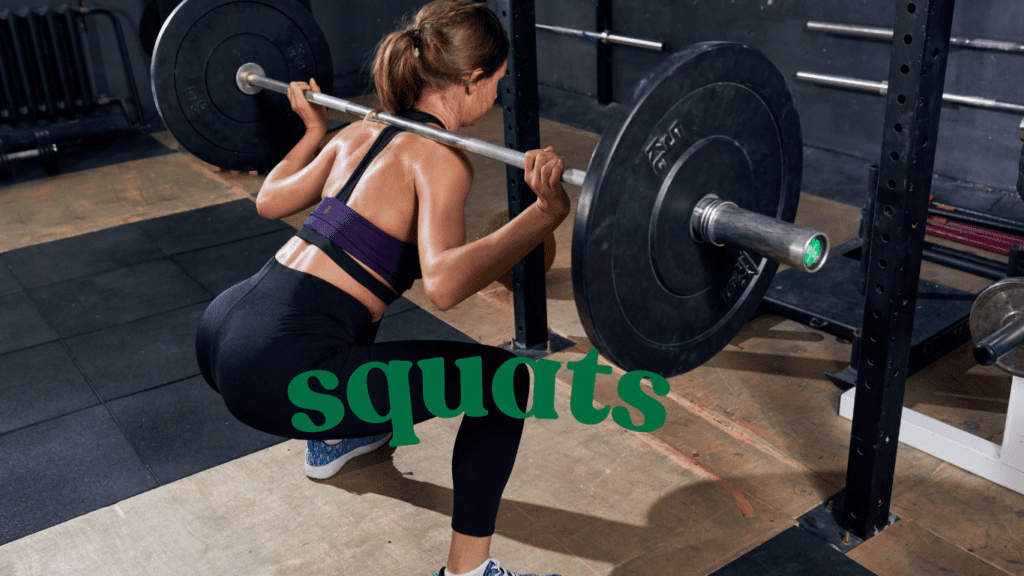 a woman doing squats at the gym 