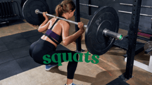 a woman doing squats at the gym 