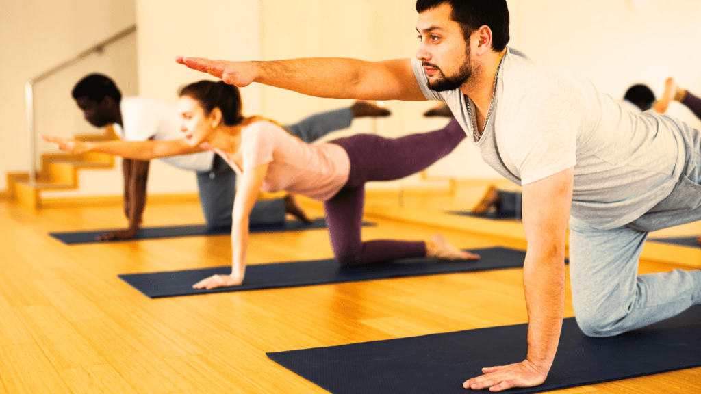 A group of people doing a Bird-Dog Exercise