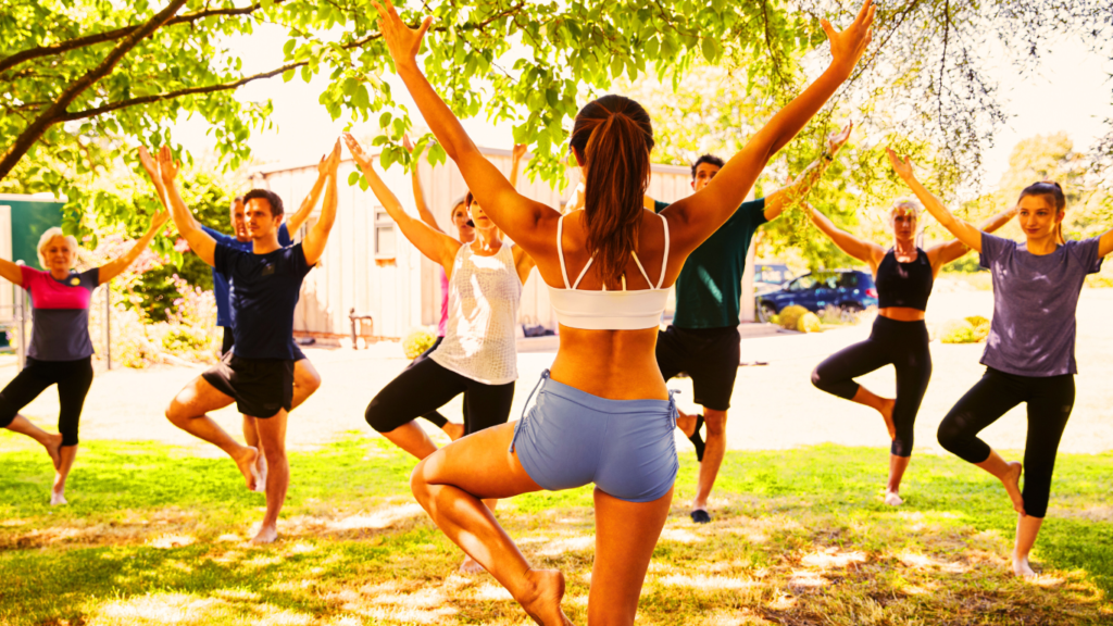 A Yoga Teacher Teaching Yoga Outdoor 