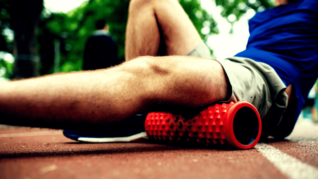 A Man Foam Rolling His Leg