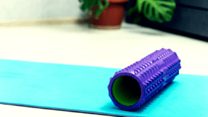 A Foam Roller On A Yoga Mat 