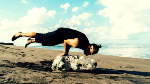 A Yoga Pose By The Beach Showing The Internal Spiritual, Material and Emotional Balance