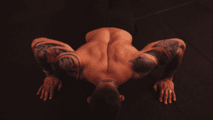 A Bodybuilder doing push ups.