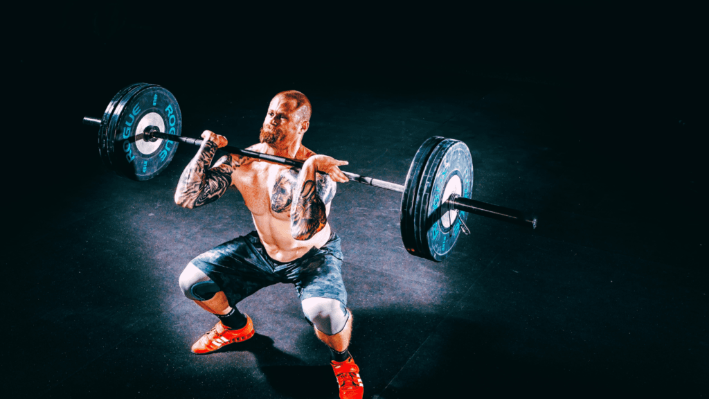 A Bodybuilder With Big Muscles Over 40 Years Old Lifting Barbel With A Lot Of Weight