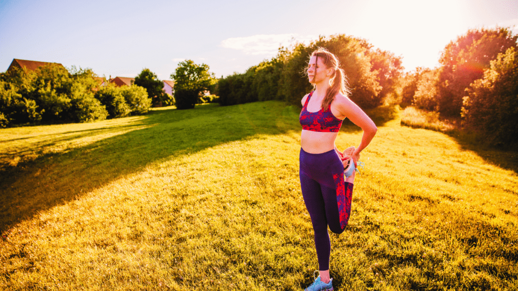 A Woman Stretching Her Legs Outdoor 