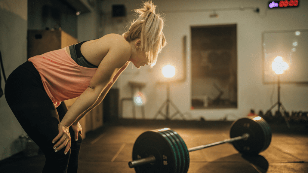 How Many Rest Days Per Week: A Tired Woman At The Gym