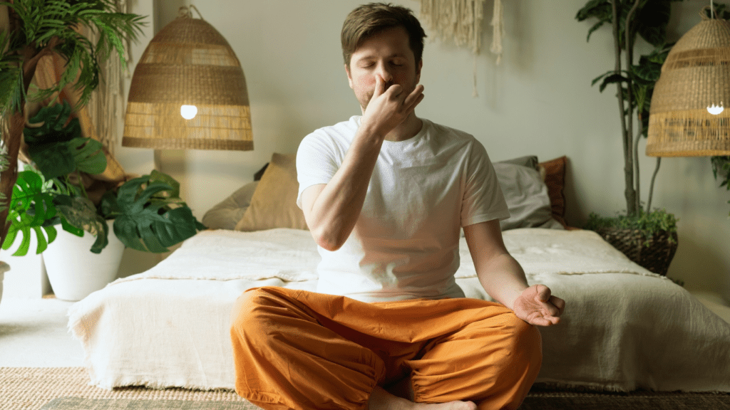  Man Doing Nadi Shodhana (Alternate Nostril Breathing) Yoga Photo